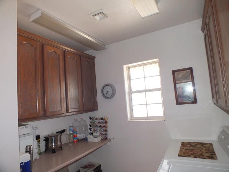 an unfinished kitchen with wooden cabinets and appliances