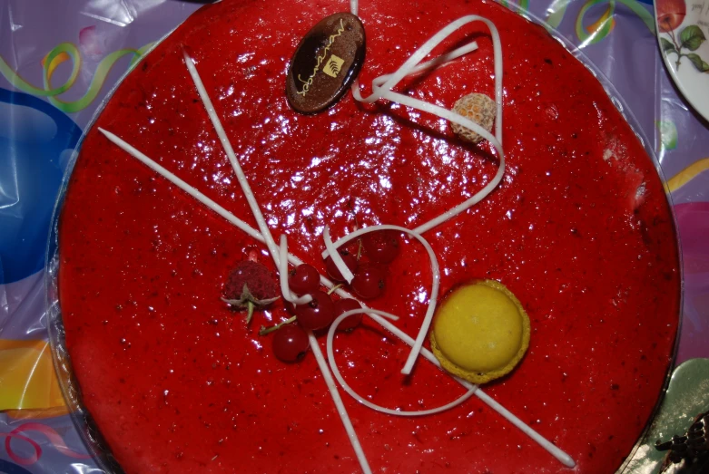 the red plate is adorned with a few decorations