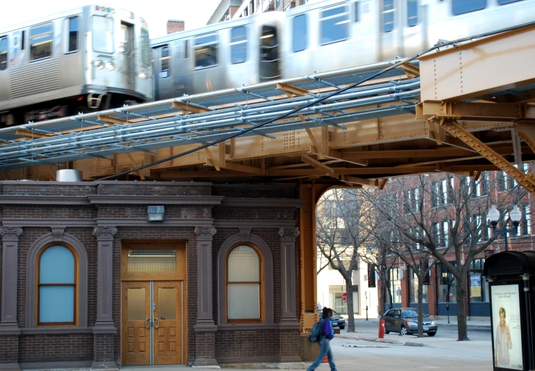 a train traveling through the city on a track