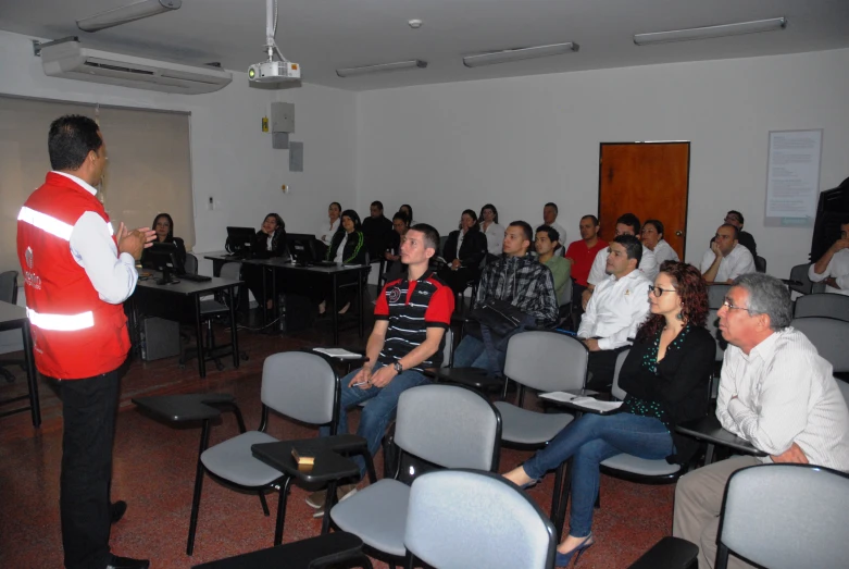 a crowd is attending to a presentation