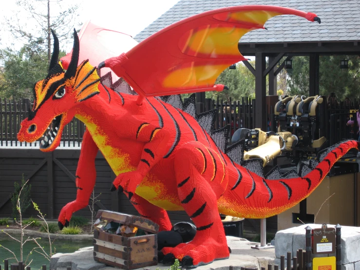 an inflatable dragon sitting on top of a wooden crate