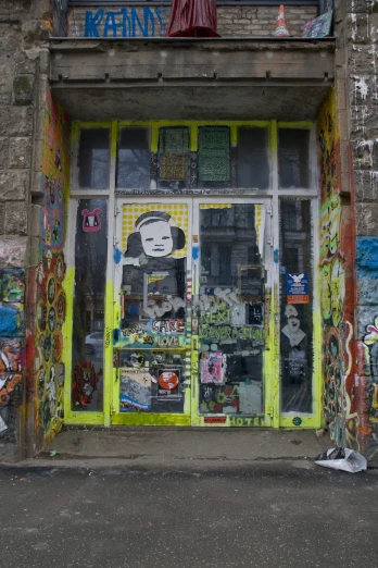 a graffiti store entrance with a giant painting on the wall