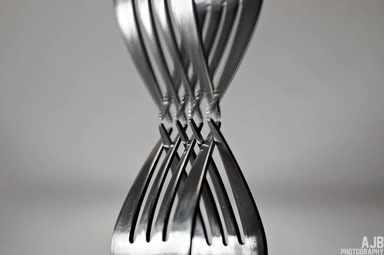 a close up view of several forks and spoons