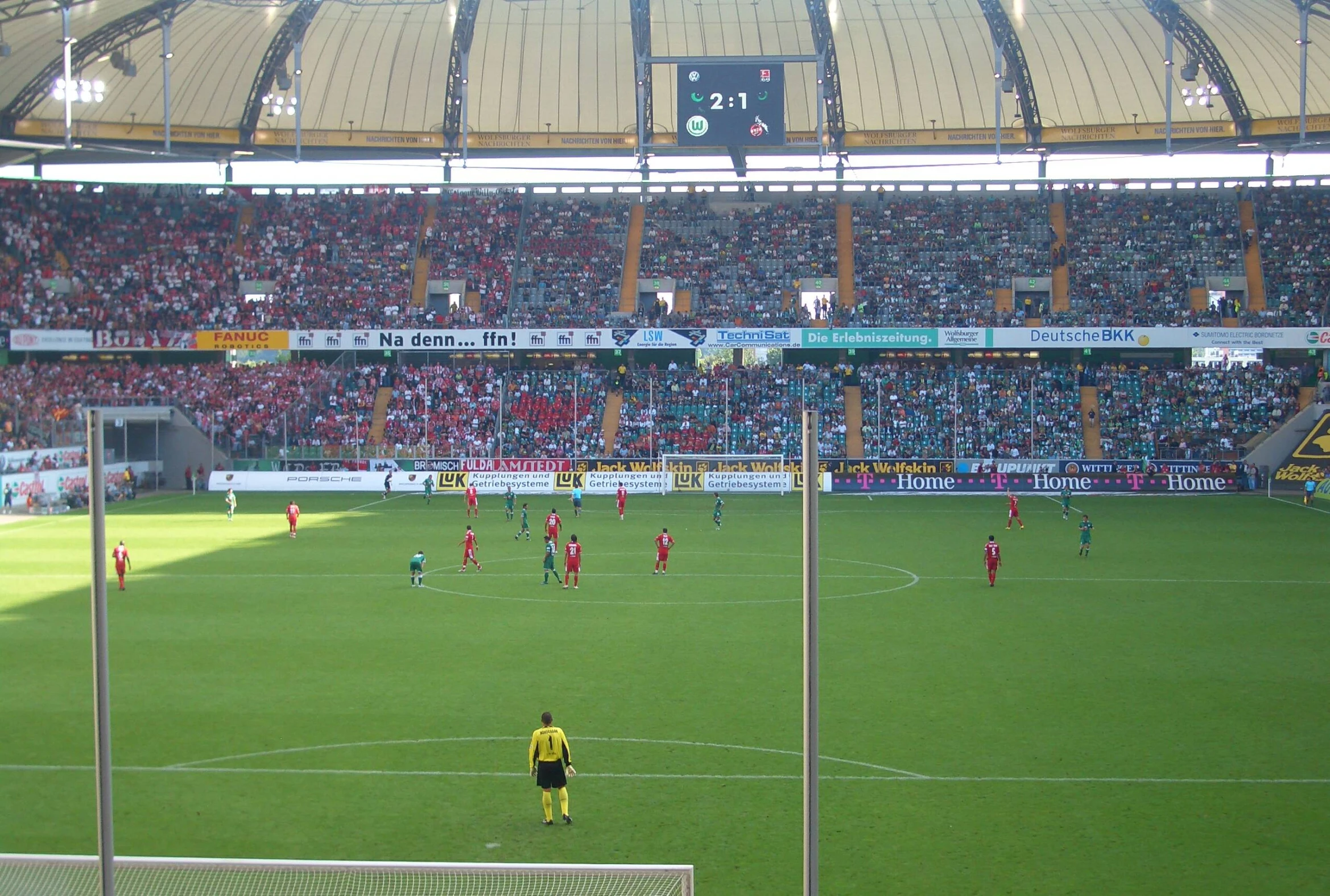 an empty soccer stadium filled with people watching a game