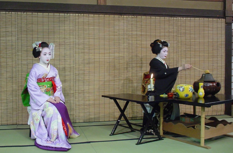 geisha dolls dressed in traditional japanese dress talking