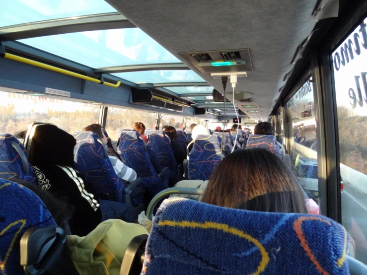 the bus filled with people are all ready for the next ride