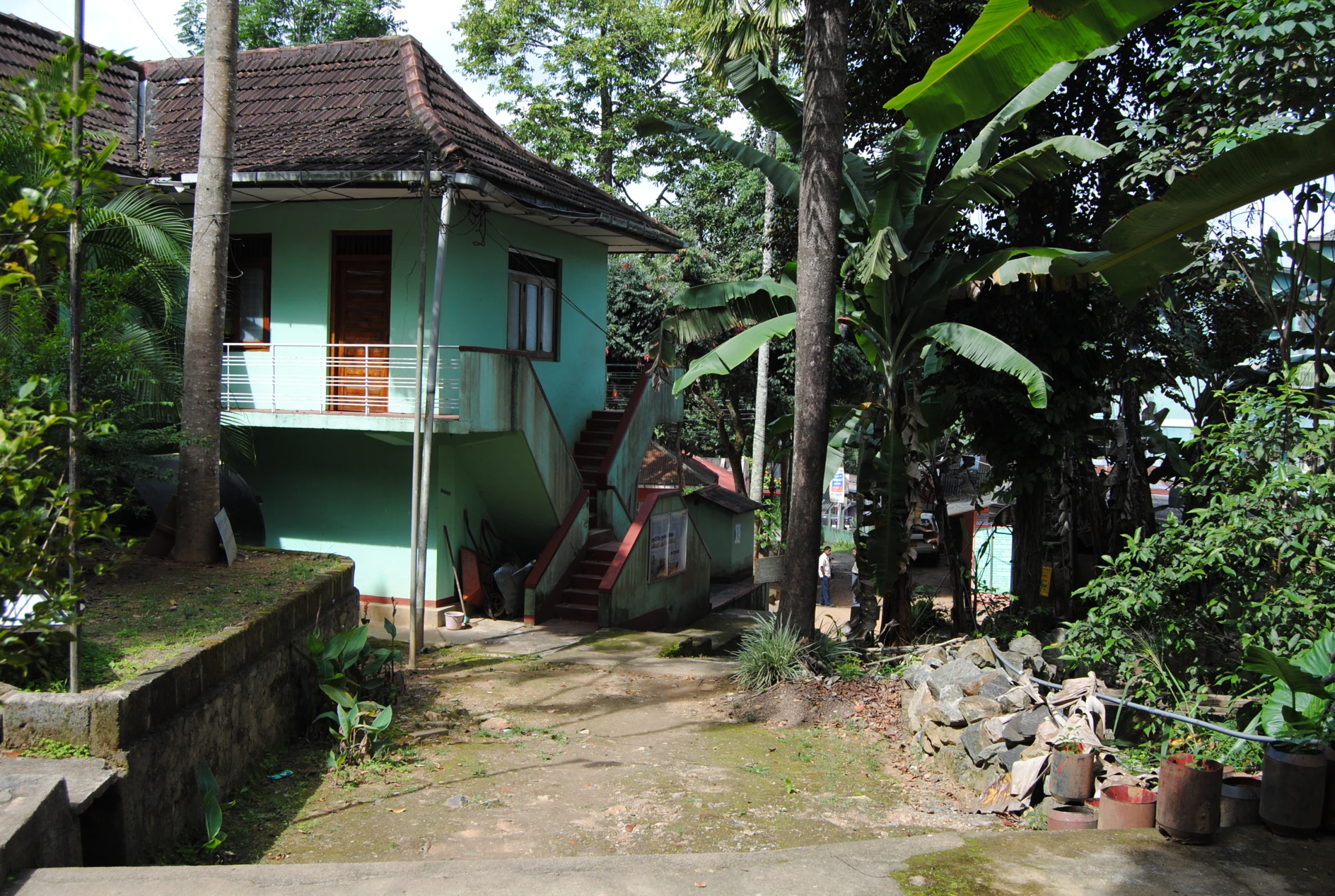 two story building and steps to small house