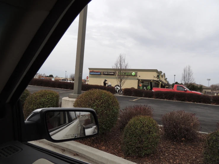 a car passing down a street with cars behind it