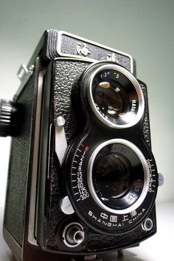 an old camera with a white background