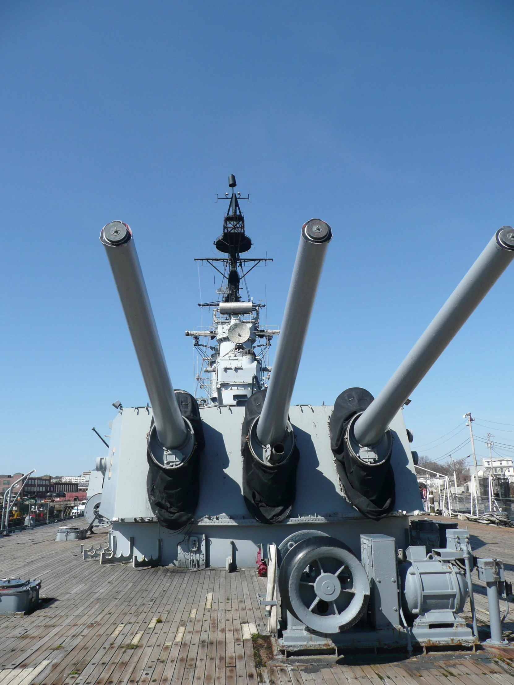 a ship with some big pipes and a building