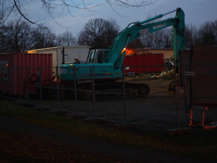 an excavater is parked at the site of a construction site