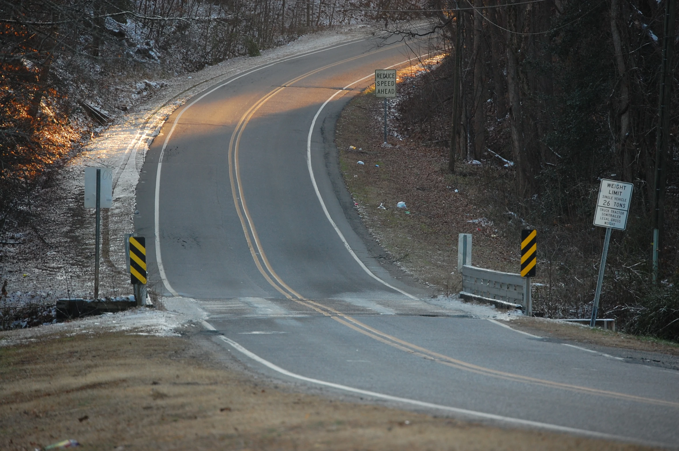 there is a very small traffic signal at the top of the hill