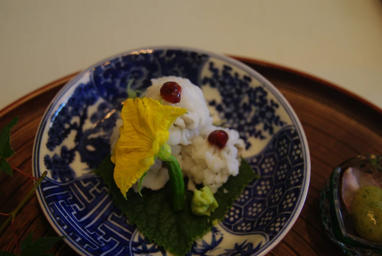 food is sitting on a blue and white plate