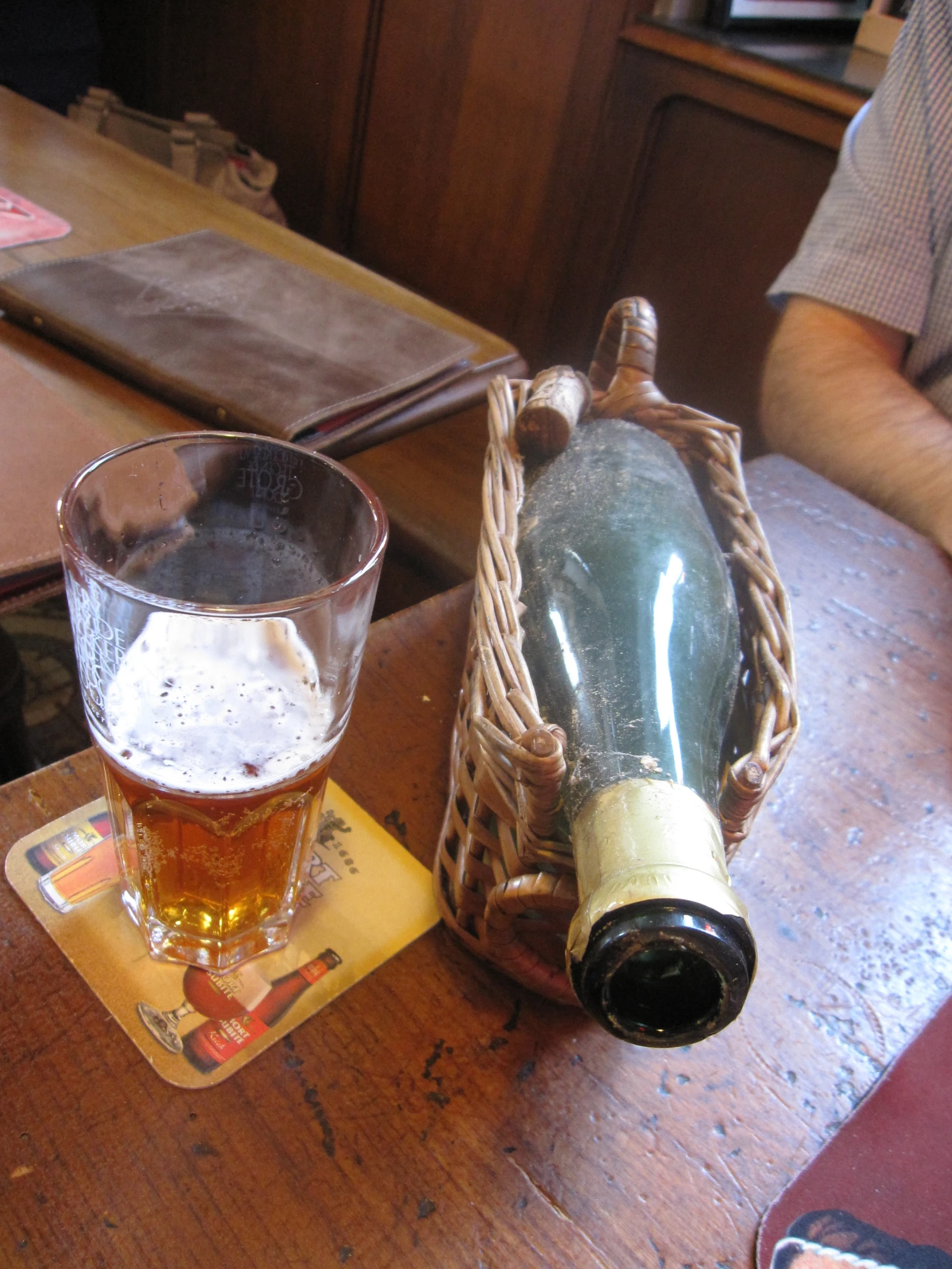 a bottle and a glass on a table