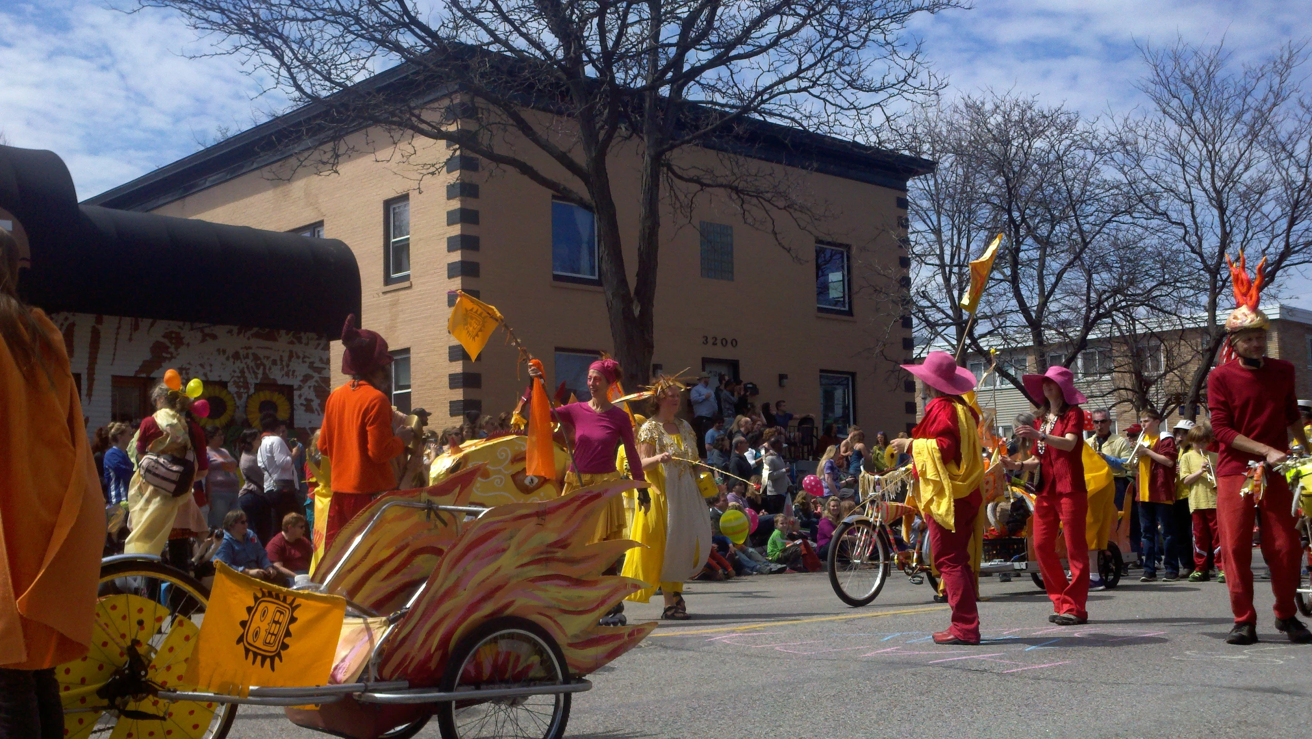 a group of people in fancy costumes on street