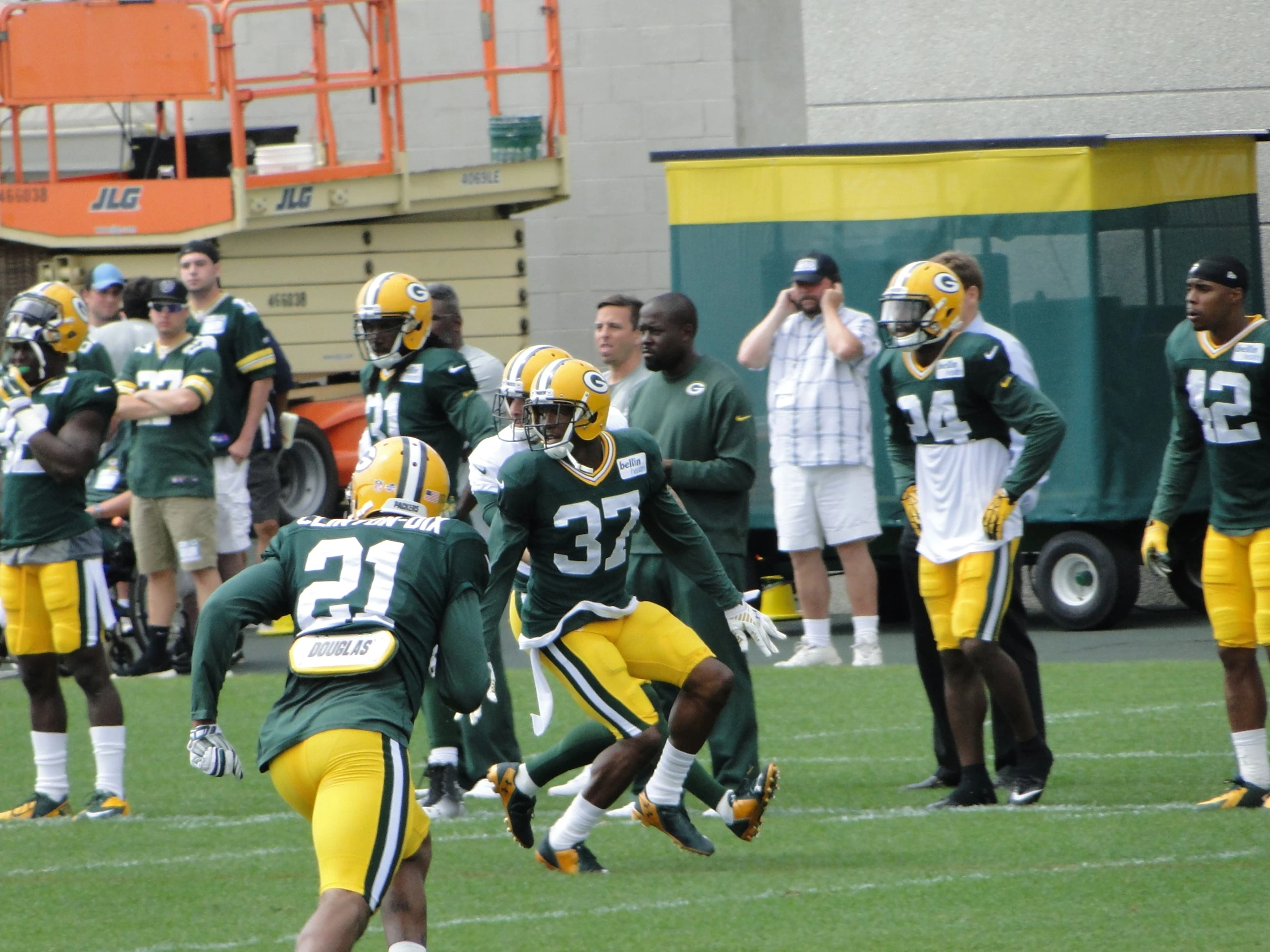 the green bay packers huddle together on the field during a game