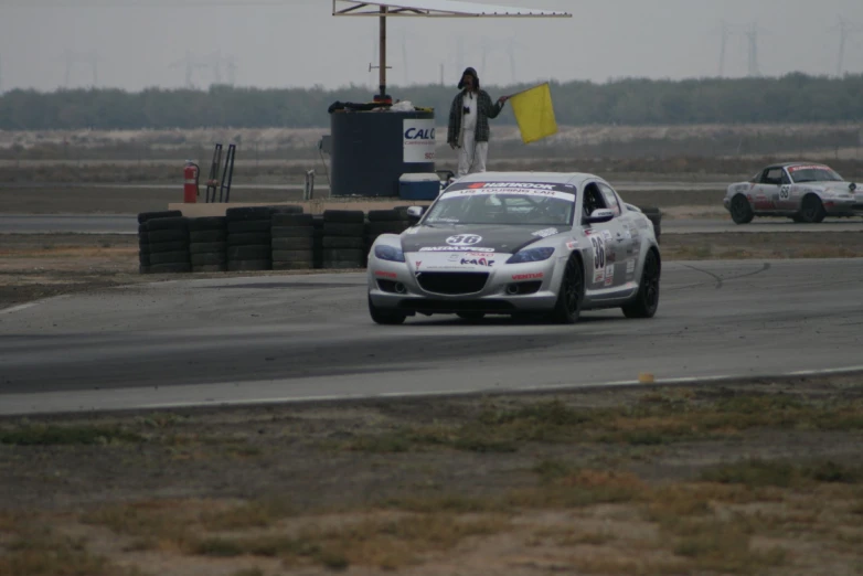 the car races at the starting line on the track