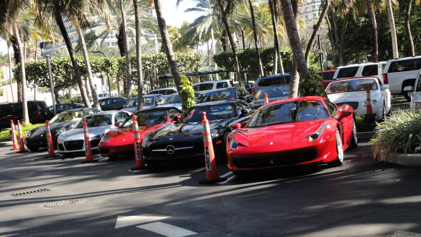 a row of sport cars lined up at an office parking lot