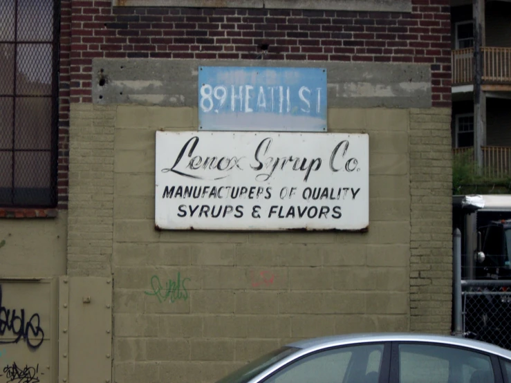 an old sign that has been painted on a building