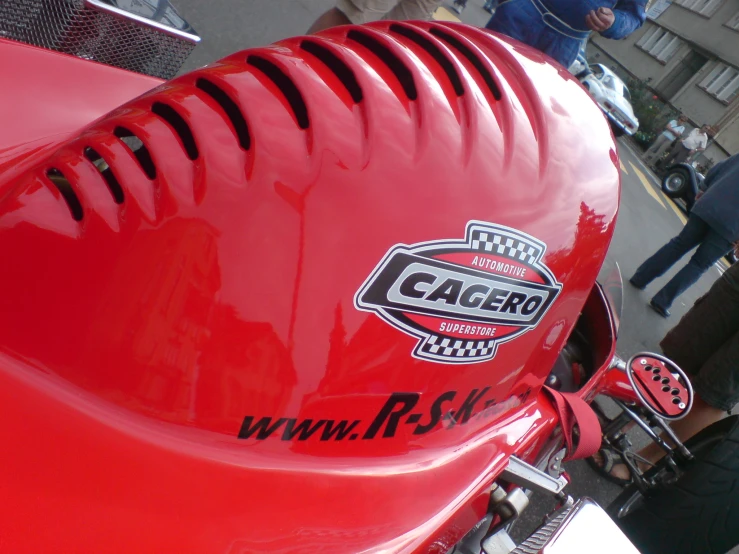 a close up of the side of a red motorcycle