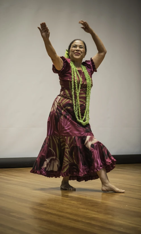 a woman dances in an elaborate dress