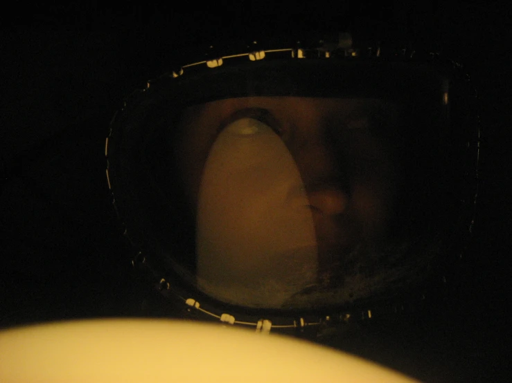 the reflection of a spaceman helmet and nose