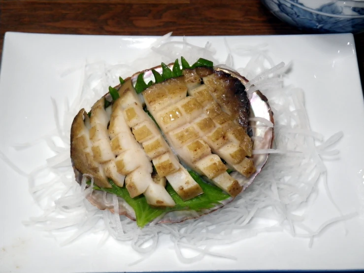 a cut - out sandwich sitting on top of plastic wrapper