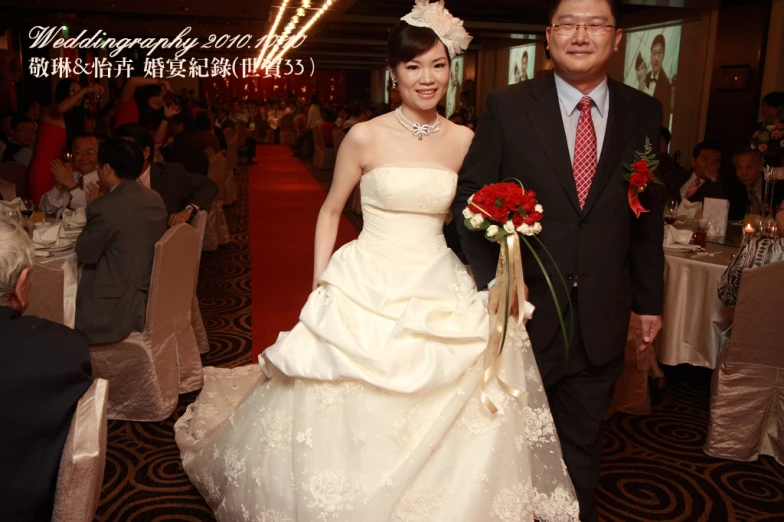 the man and woman are walking toward the wedding reception