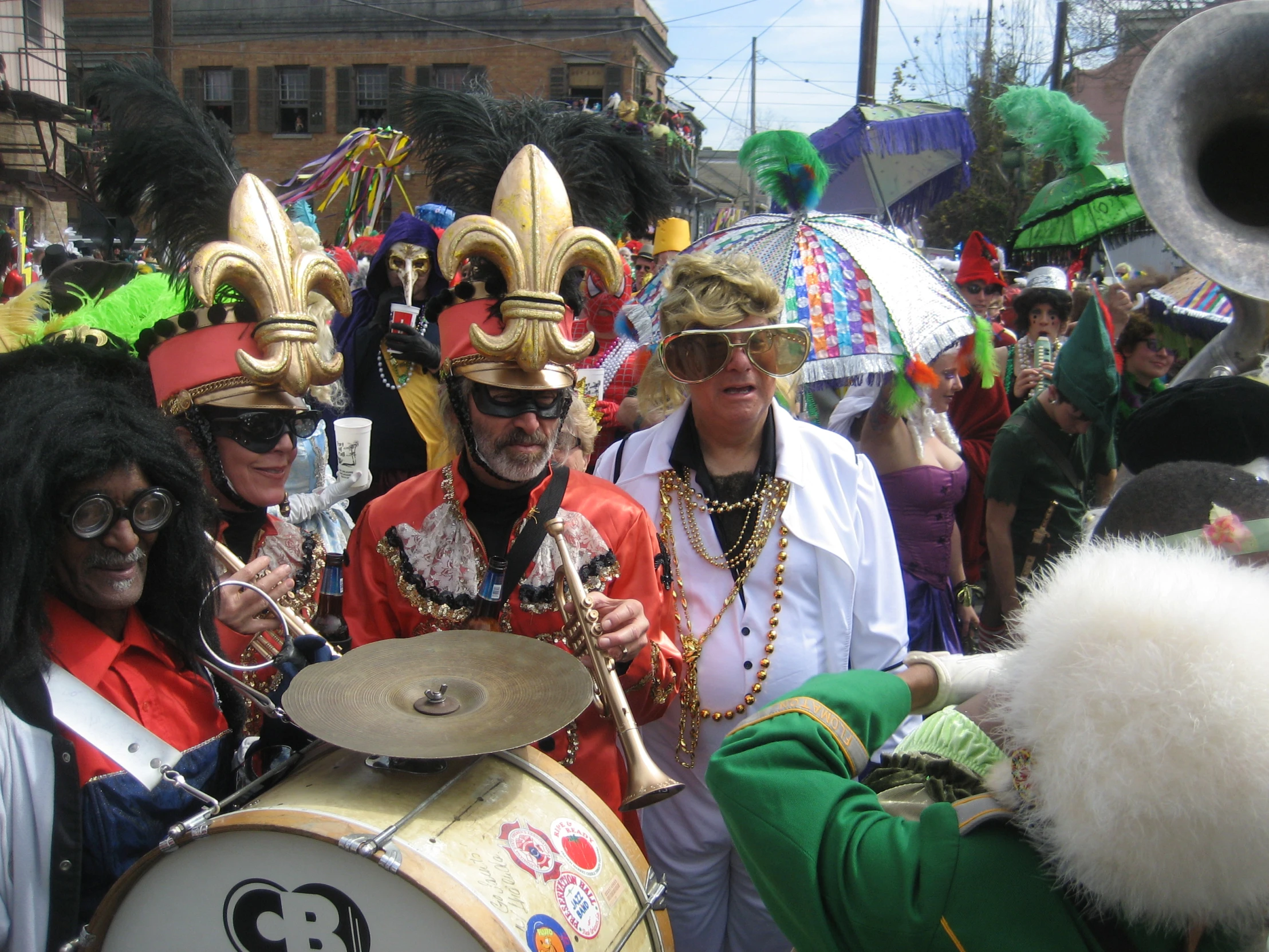 people standing in the street and dressed in costumes