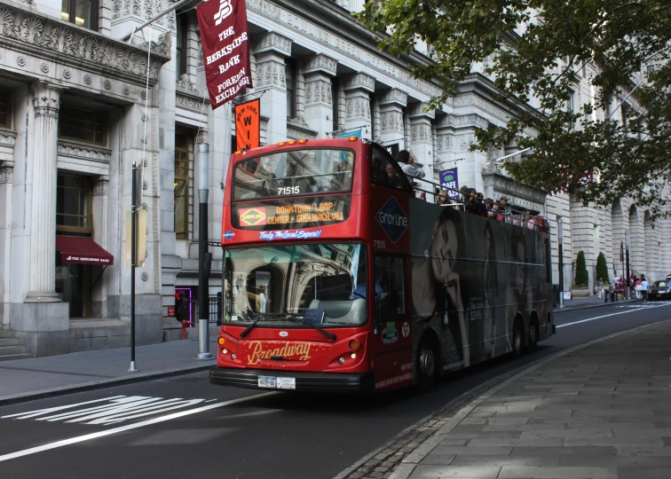 a bus travels down the street on its way