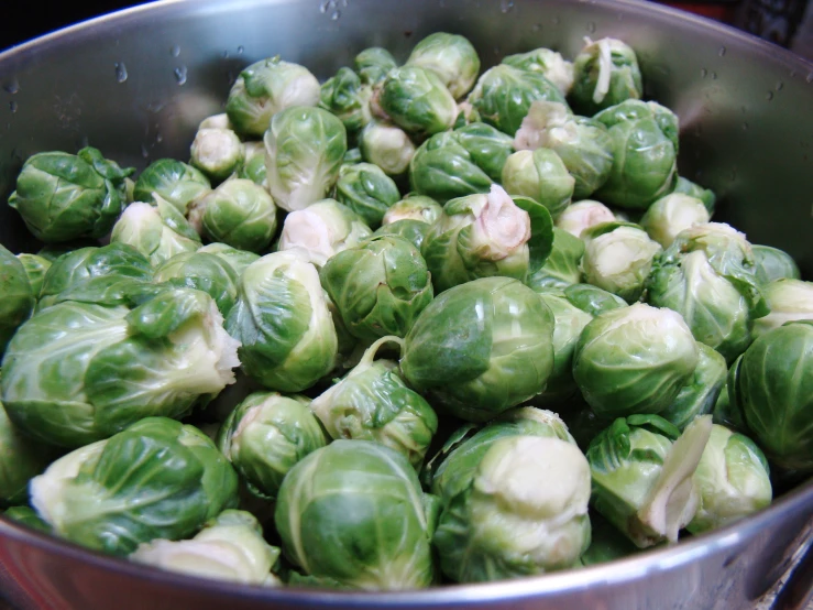 the brussel sprouts are cooked in a large pot