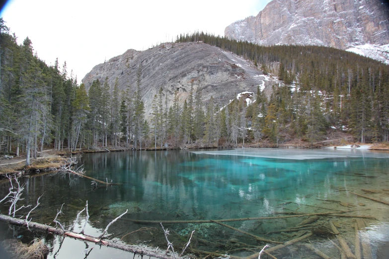 a view of an icy mountain lake with ice in it
