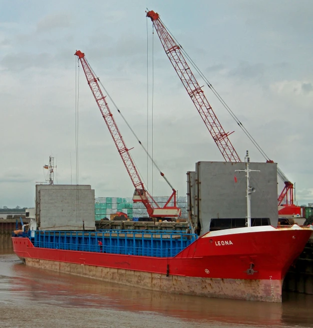 there is a large red boat at dock