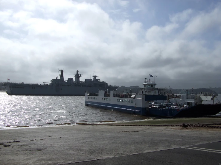 a ship and another ship floating on the water