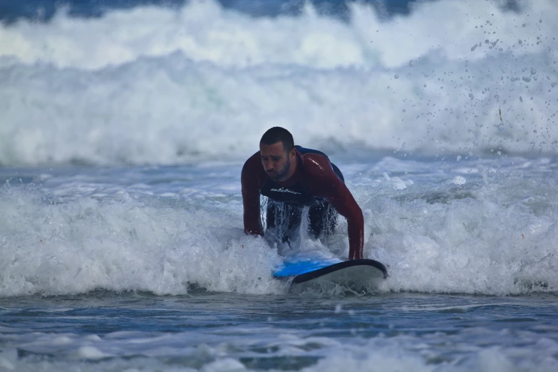 a man on a surfboard in the water