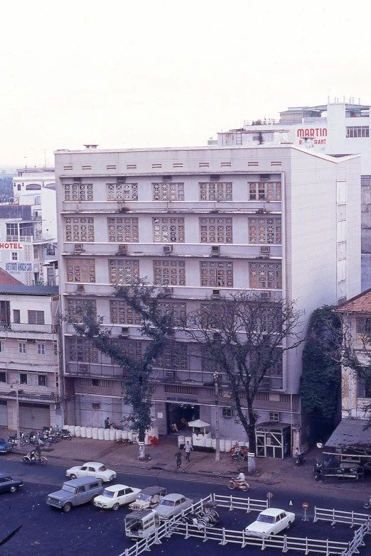 large building in a residential area with multiple stories and balconies