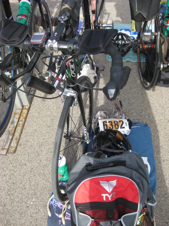 a person with bicycle with back pack and luggage