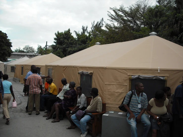 there are a bunch of people outside a tent