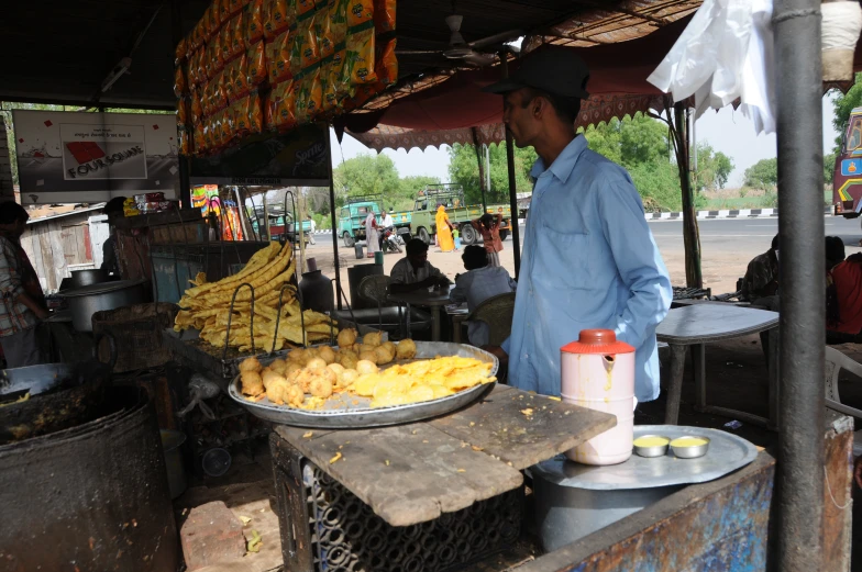 a person is looking at the food items on display