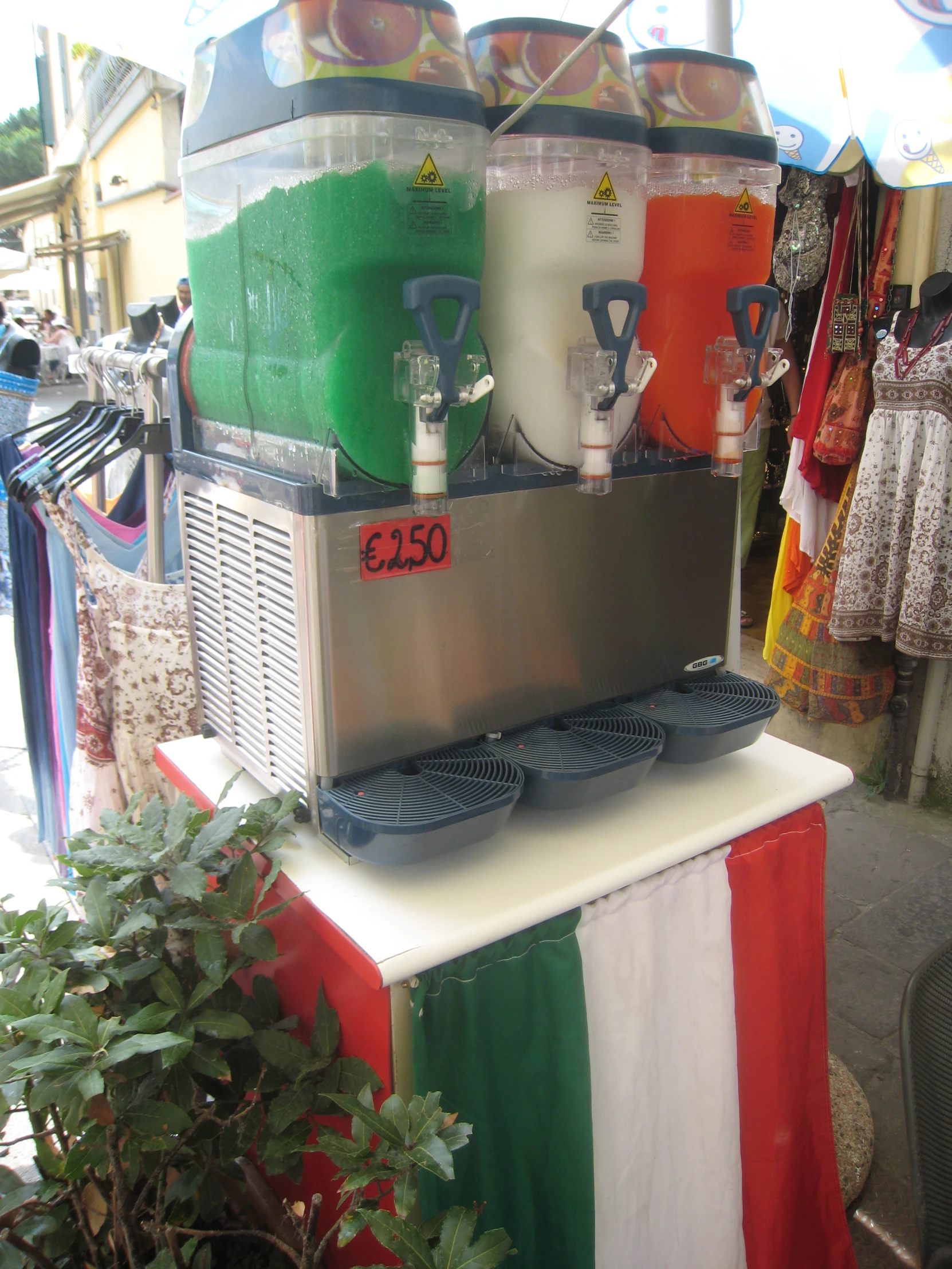 bottles of juice sitting on top of an italian flag