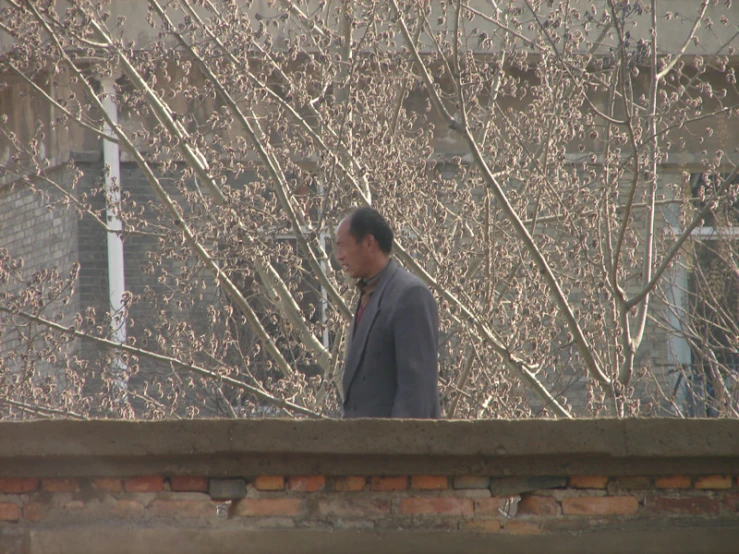 a man is standing on a rooftop outside