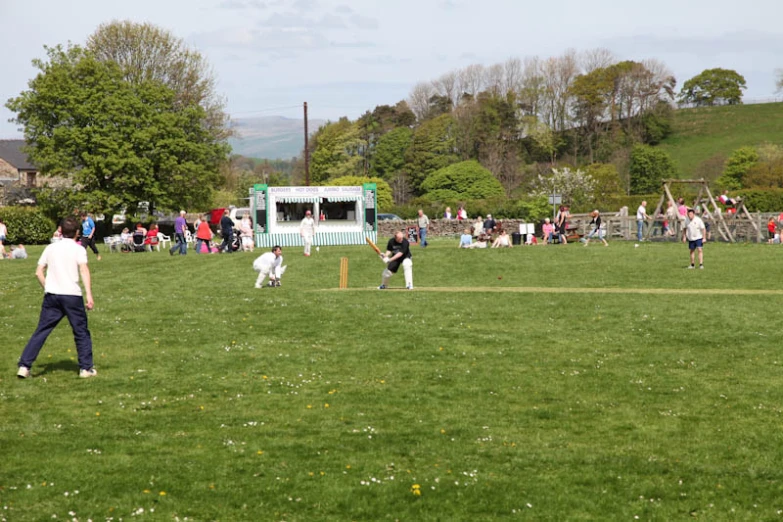 children playing game in the middle of a park