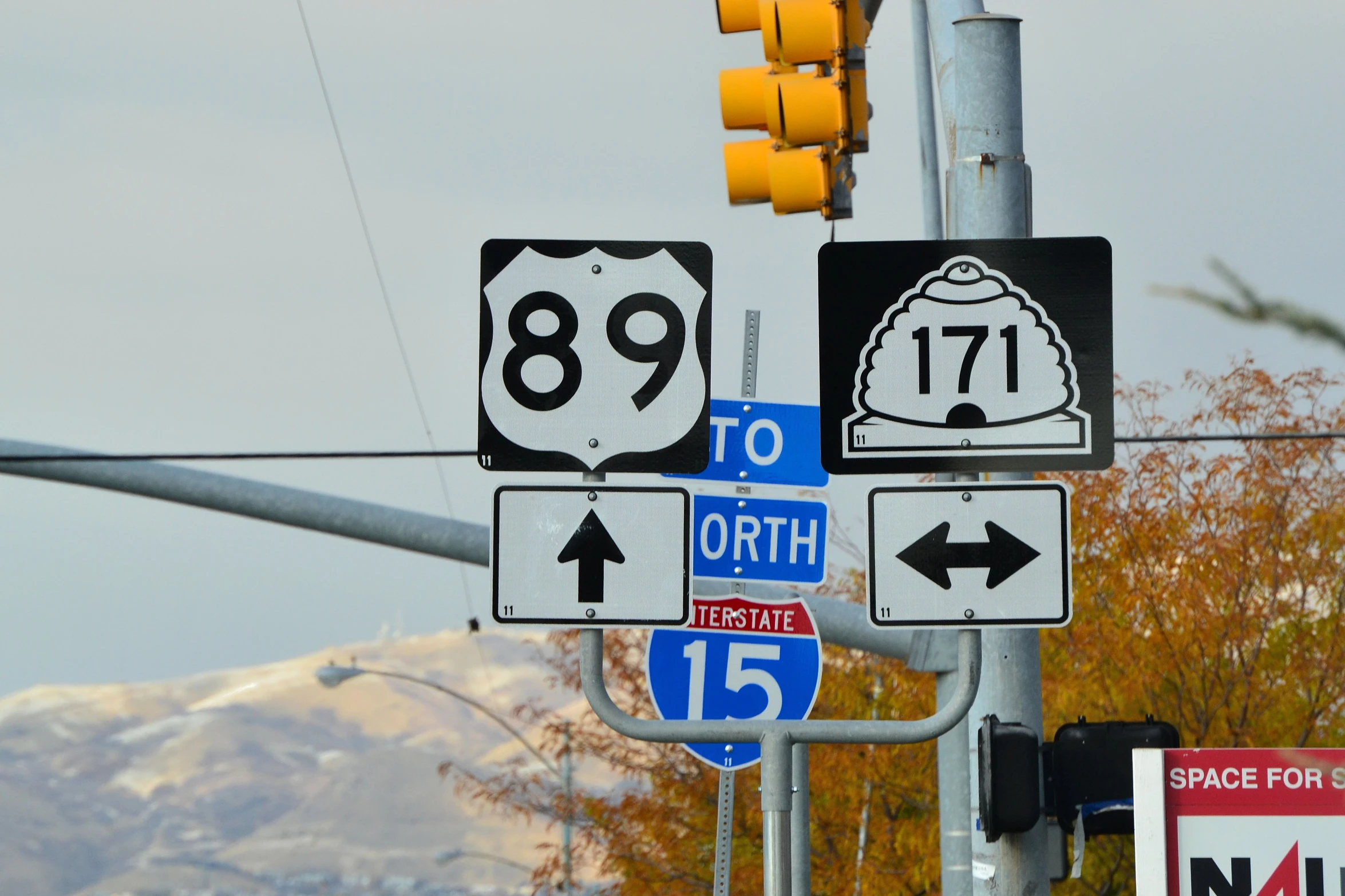 a view of an intersection with multiple street signs