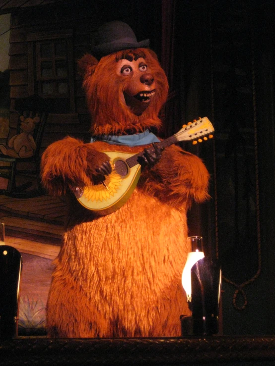 an image of a bear playing guitar at a concert