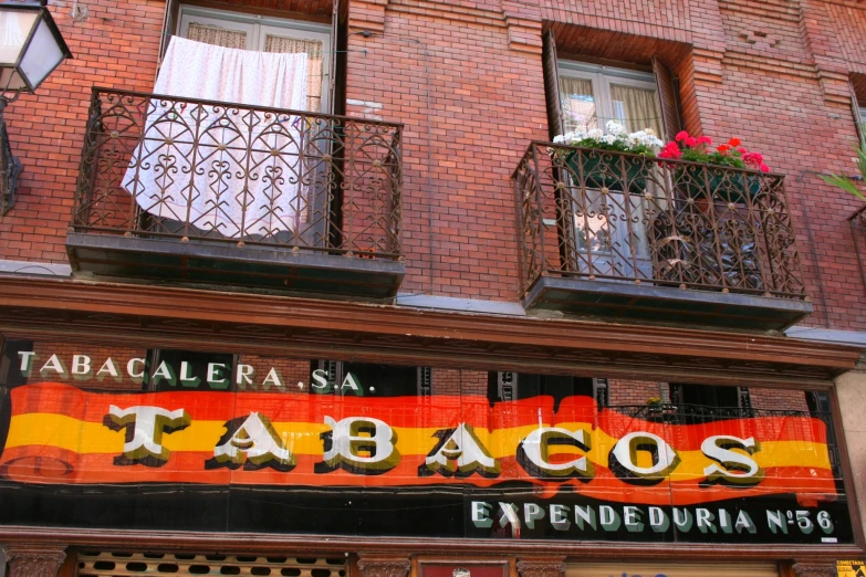 the name of a bar called tabacos on the side of a building