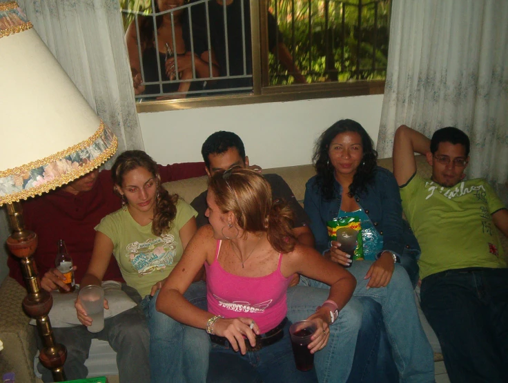 a group of people are sitting on a couch
