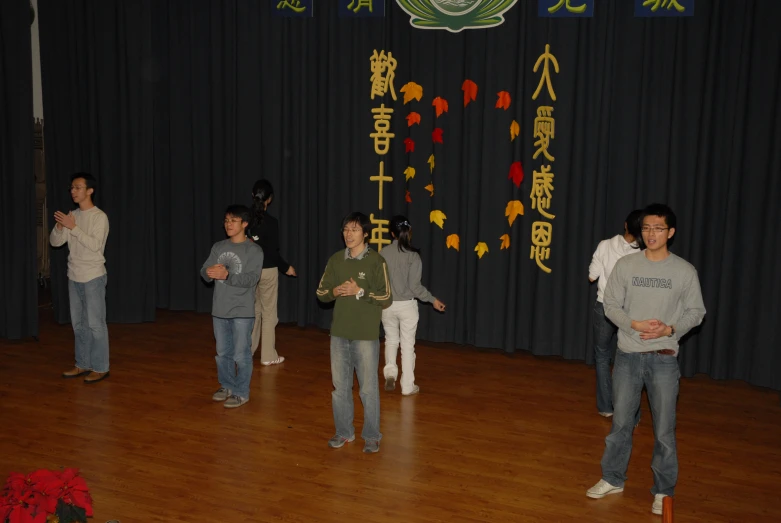 a group of people playing wii bowling at a convention