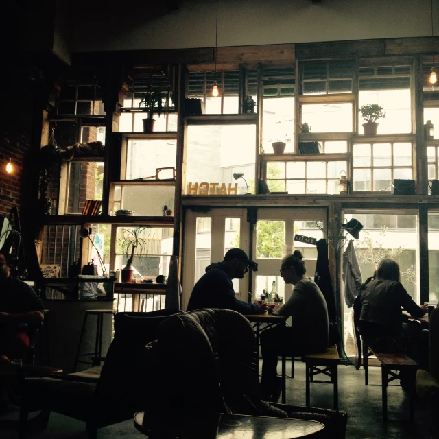 a group of people sitting around a table