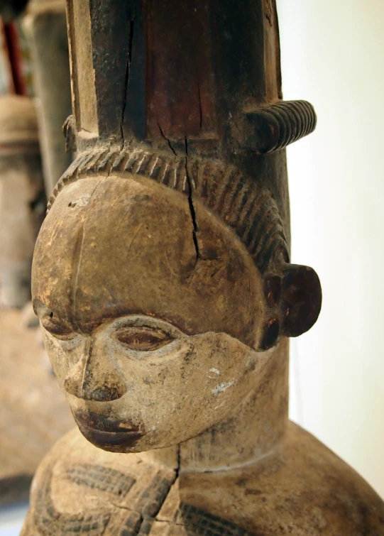 an ancient carving of a person on a table