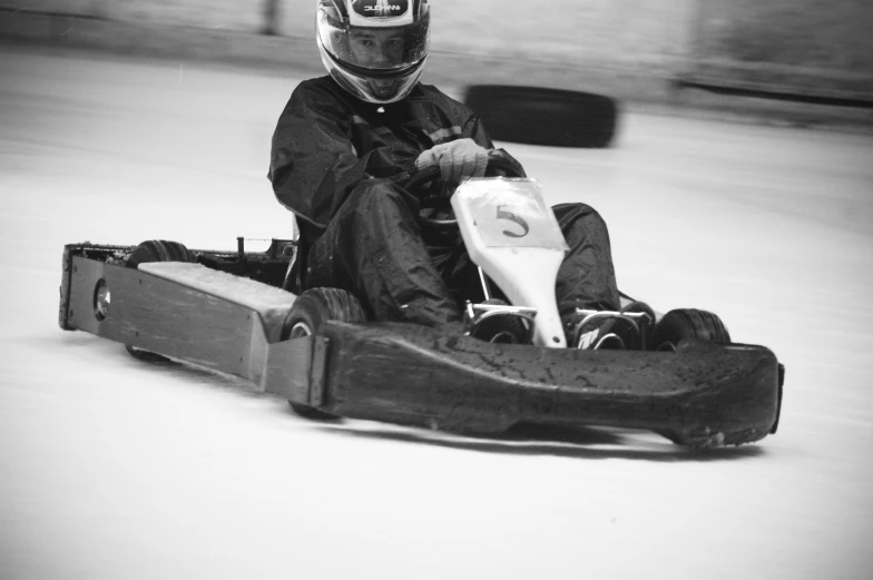 a person riding a motorcycle with a snowboard strapped to its back